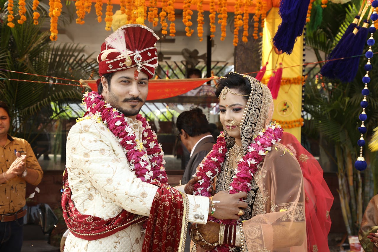 our-services-2 A couple in traditional attire exchanging vows at a vibrant Indian wedding in Indore.