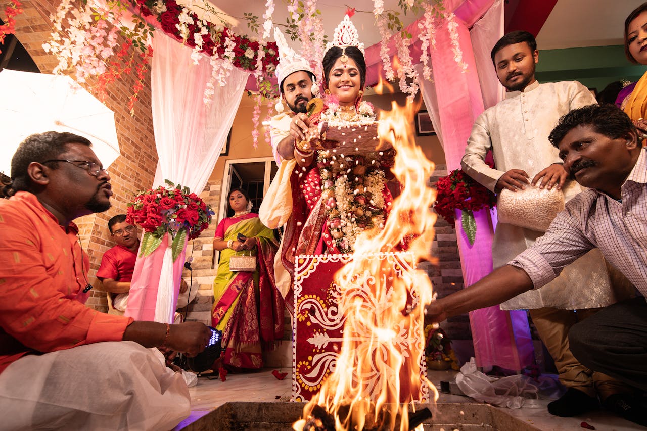 our-services-3 Vibrant Bengali wedding ritual in Kolkata, capturing a couple's sacred vows by the ceremonial fire.